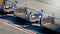 Empty baggage transportation cars on airport runway