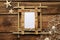 Empty bamboo frame, starfishes, seashells and fishing net on wooden table, flat lay