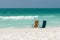 Empty Beach Chairs In The Surf