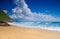 Empty beach with clouds