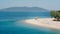 Empty beach in Greece with one sunshade