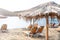 Empty beach in Greece. Sun loungers and straw umbrellas