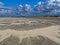 Empty beach landscape by strong sea breeze and Cumulus clouds