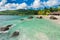 Empty Beach in Seychelles, Mahe island. Rocks and Palm trees in background. Indian Ocean.