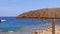 Empty Beach with Umbrellas in Egypt on the background of a Coral Reef in the Red Sea