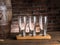 Empty beer glasses near a cask on wooden table. Craft brewery