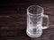 Empty beer mug, large empty pint of beer on old wooden table