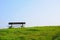 Empty bench on a green grass