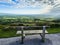 An empty bench near the edge of the road at Vee Pass, a v-shaped turn on the road leading to a gap in the Knockmealdown mountains