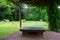 Empty bench in the shady garden. Japanese gardens