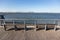 Empty Benches along a St. George Waterfront Park in Staten Island of New York City with a view of the Lower Manhattan Skyline
