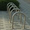 Empty bicycle parking metal rack near the road