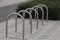 Empty bicycle parking metal rack near the road