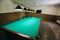 Empty billiard table with lamps above it. Sports and indoor games free time concept