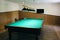 Empty billiard table with lamps above it. Sports and indoor games free time concept