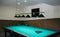 Empty billiard table with lamps above it. Sports and indoor games free time concept