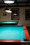 Empty billiard table under the lights