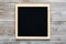 Empty black letterboard on wood background. Design mockup