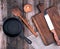 empty black round cast iron pan with handle, wooden cutting board