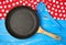 empty black round nonstick frying pan with handle