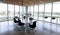 Empty black swivel chairs arranged around desk in modern office