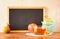 Empty blackboard, apple, honey and pomegranate. rosh hshanah concept.