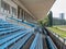 Empty blue seats benches at stadium, hippodrome, race track