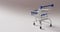 Empty blue shopping trolley on seamless grey background