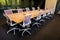 Empty boardroom table and chairs