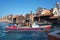 Empty boatyard Squero Venice, the home of the gondola. Passenger ship passes by the yard. Venice suffers lack of