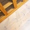 Empty bookcase on wooden floor