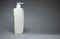 Empty bottle of cosmetics or shower products on a gray background