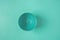 Empty Bowl on Turquoise Background. Identical Monochrome Pastel Colors. Minimalist Creative Geometrical Image