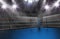 Empty boxing ring in arena, spot lights, smoke and dark night sc