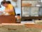 Empty bricks wall with blurred cafe background.