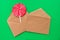 An empty brown envelope contains a lollipop. The second craft envelope is empty and clean. Gift for Christmas and New Year. Flat
