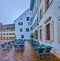 Empty cafe on Munsterplatz square on a rainy day, Basel, Switzerland