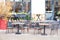 Empty cafe with terrace with tables and wooden chairs. Street vintage exterior of restaurant.