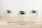 Empty canning jars on a wooden tabletop.