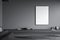 Empty canvas on wall of minimalist grey living room