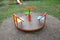 Empty carousel, roundabout on children playground without kids