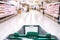 Empty cart point of view at the store market buying food and articles - defocused interior with products and meal - lockdown and