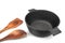 Empty Cast Iron Pot, Wooden Spatula And Serving Spoon Isolated