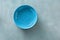 Empty ceramic blue round plate stone background top view flat lay