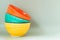 Empty ceramic colored bowls on a gray background.copy space