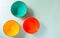 Empty ceramic colored bowls on a gray background. View from the top.Copy space.