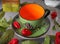 Empty ceramic colourful tea cup with chillies