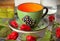 Empty ceramic colourful tea cup with chillies