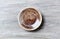 Empty ceramics plate on rustic wooden background. Top view.