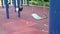 Empty chain swings in modern children playground in city. Sunny day.